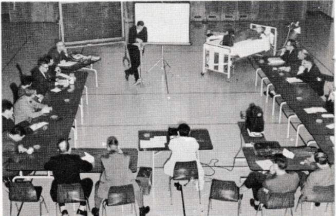 Dr. Spoerel giving a lecture and demonstration on respiratory resuscitation.