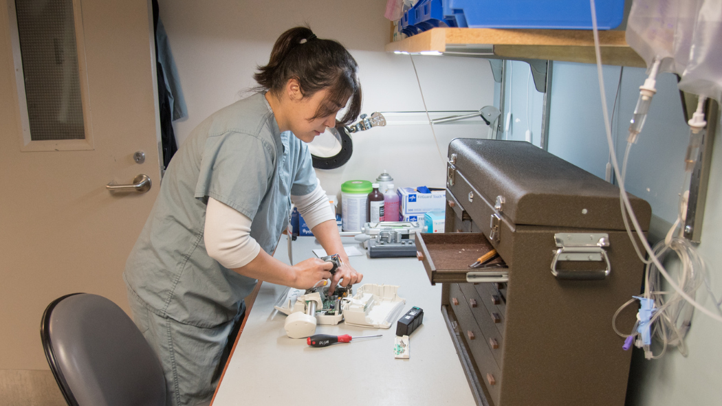 technologist works on pump